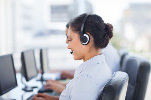 20467983 - attractive brunette working in a call centre with her headset
